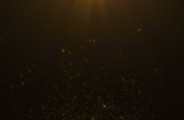 Obraz premium Abstract background of flickering gold particles and light flare