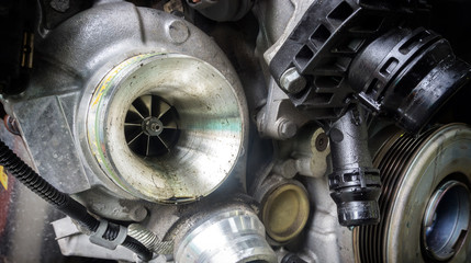 Close up of Turbocharger Compressor Wheel in car for booster horsepower, Turbine Blades , abstract...