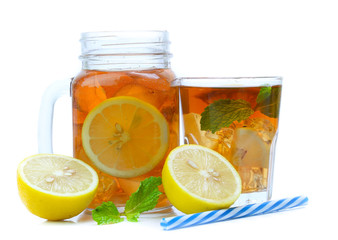 iced tea with lemon slices and mint on white background