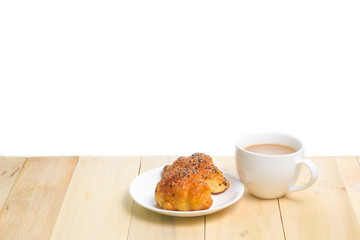 Coffee and croissants on the wood