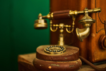 Vintage telephone, old retro radio on wood table