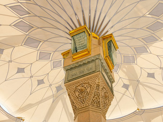 Medina, Saudi Arabia - March 22, 2018 : Exterior view of umbrella tower in Nabawi Mosque (Prophet Mosque) building in Medina. Selective focus