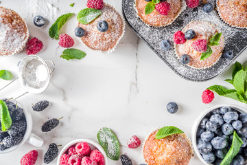 Muffins or cupcakes with berries
