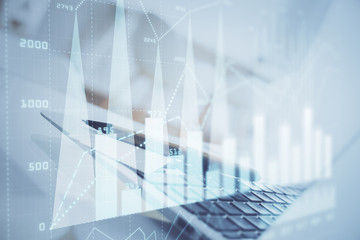 Forex graph hologram on table with computer background. Multi exposure. Concept of financial markets.