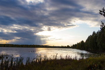 Autumn lake in cloudy weather