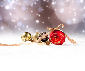 Chritsmas red ball in snow with celebration decoration. Free space for text 