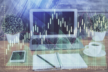 Double exposure of forex graph and work space with computer. Concept of international online trading.