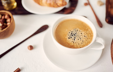 cup of fresh espresso on table, view from above