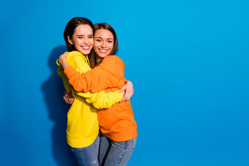 I missed you so much. Photo of two pretty girlfriends lady holding each other in close hugs wearing...