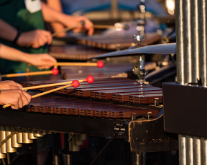 sideline percusionists performing at an outddors rehearsal