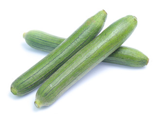 fresh green sponge gourd or luffa with slice isolated on white background
