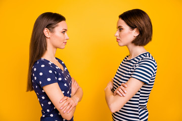 Profile photo of two amazing ladies standing opposite dislike each other competitive mood wear...