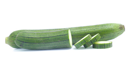 fresh green sponge gourd or luffa with slice isolated on white background