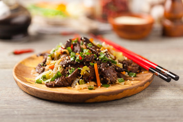 Traditional Korean Bulgogi dish.  Thinly cut, grilled beef, served with rice and vegetables.