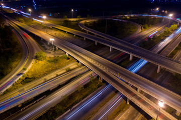 Fototapeta na wymiar aerial view ring road and interchange connecting the city at night