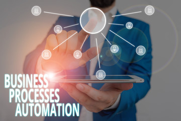 Word writing text Business Processes Automation. Business photo showcasing performed to achieve digital transformation Male human wear formal work suit presenting presentation using smart device