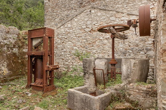 Old and ruined olive oil factory in abandoned village Palia Plagia, Greece