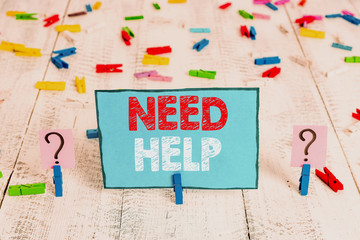 Word writing text Need Help. Business photo showcasing When someone is under pressure and cannot handle the situation Scribbled and crumbling sheet with paper clips placed on the wooden table