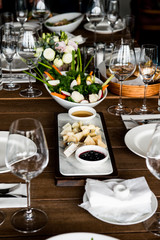 Restourant's table prepared for celebrating event. table set for wedding or another catered event dinner.