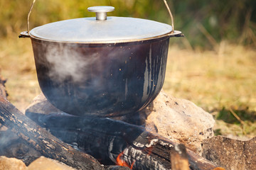 Preparing of a soup on open fire