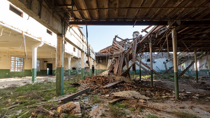 Fototapeta na wymiar abandoned and ruined industrial building