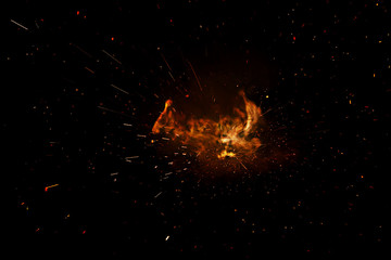 Fototapeta na wymiar fire flames with sparks isolated on black background