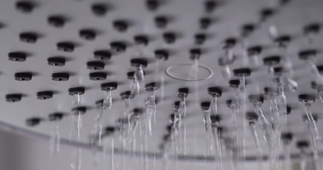 Close-up shot water drop from rain shower with dark and grain processed