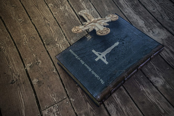 exorcism book on wooden floor