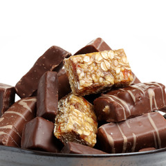 Chocolate peanut candy on white background
