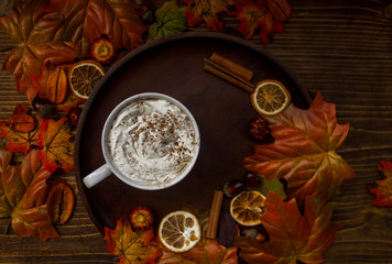 Top view of warm cup of coffee with autumnal details