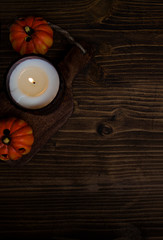 Moody view of candle and pumpkin decorations