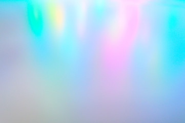 Blurred multicolored background from light. Iridescent holographic abstract soft pastel colors...