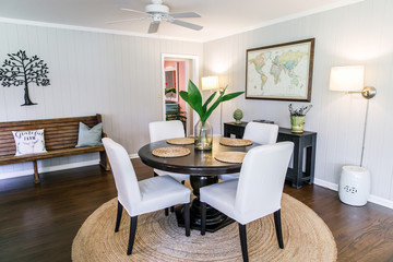 Small eat-in kitchen dining room with a small table for four and upholstered chairs