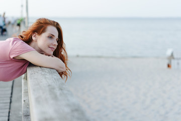 Attractive serene young woman standing watching
