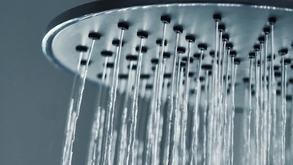 Close-up shot water drop from rain shower with dark and grain processed