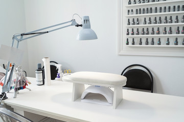 Workplace for manicure in a beauty salon. A cozy place for a manicurist.