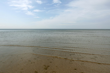 Shoal of the Baltic Sea in the Gulf of Riga in Jurmala on a calm sunny day