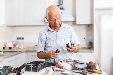 Elderly man working on home renovations