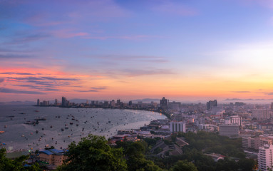 Fototapeta na wymiar Pattaya City and Sea with sunrise, Thailand. Pattaya city skyline and pier at sunset in Pattaya Chonburi Thailand
