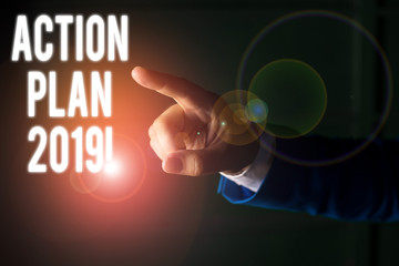 Word writing text Action Plan 2019. Business photo showcasing proposed strategy or course of actions for current year Isolated hand pointing with finger. Business concept pointing finger