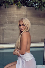 Young blonde in summer open studio