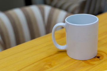 white cup on breakfast table