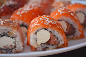 Sushi. Philadelphia classic. Salmon, Philadelphia Cheese. Rolls with eel and soy sauce.