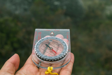 Woman hand holding a compass