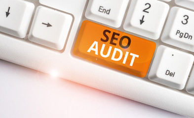 Writing note showing Seo Audit. Business concept for Search Engine Optimization validating and...