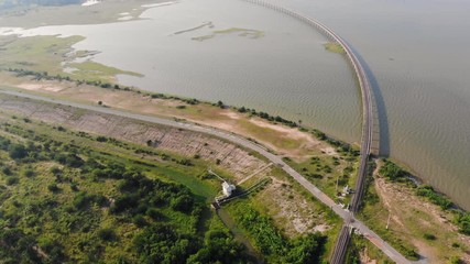 Drone shot aerial view scenic landscape of the road at the country side with a big river