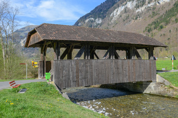 Fototapeta na wymiar Old covered wooden bridge at Wolfenschiessen on Switzerland