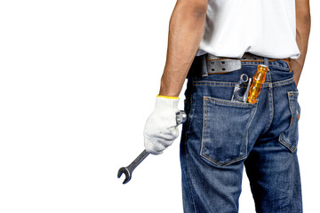 Mechanic or engineer standing on white background and holding wrench on hand