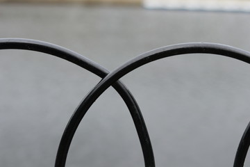 An arched fence beside a river in Yorkshire. 