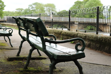 A wet bench beside a river in Otley, Yorkshire 